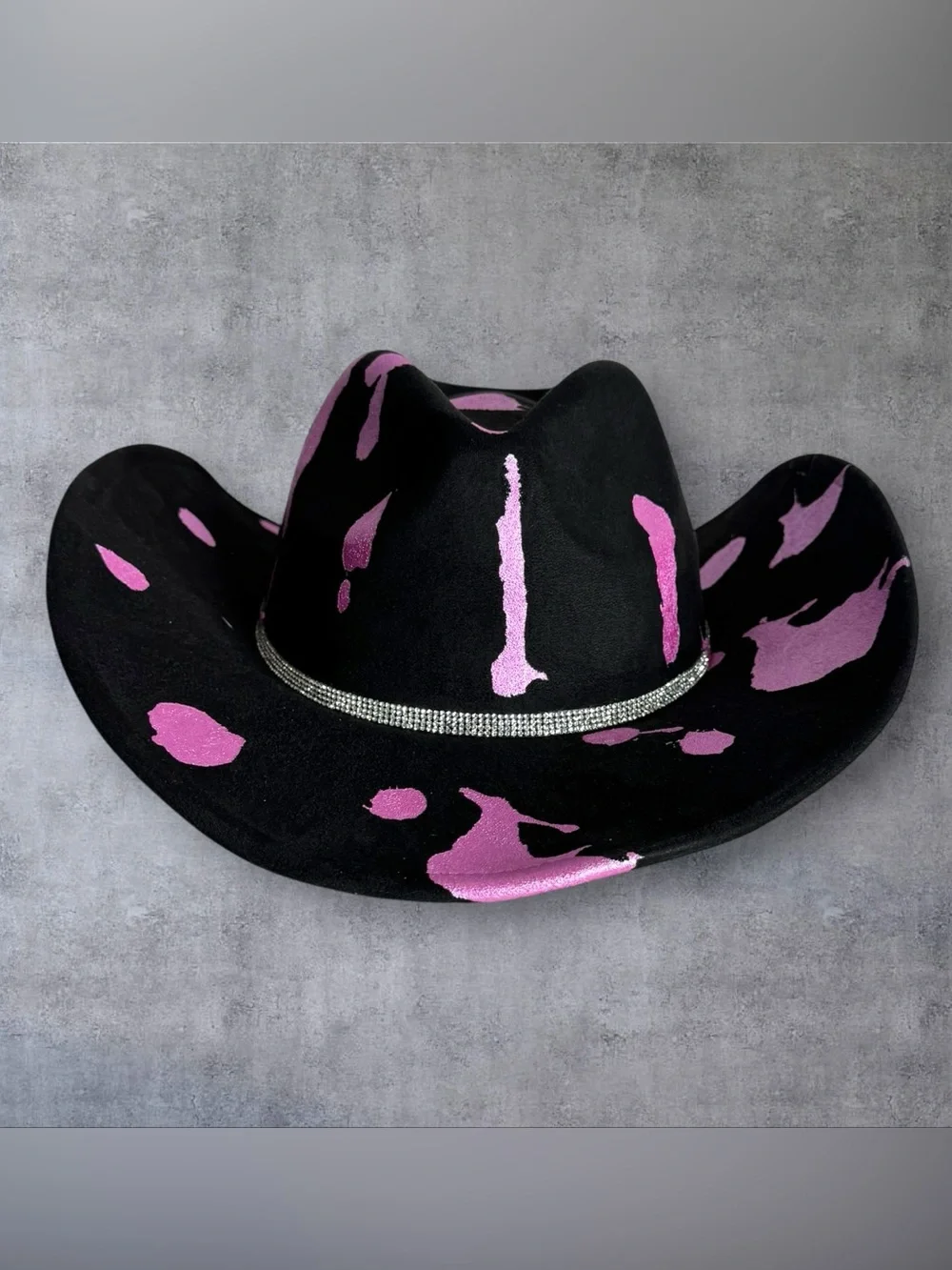 Black Cowboy Hat with Pink Accents and Star Embellishments